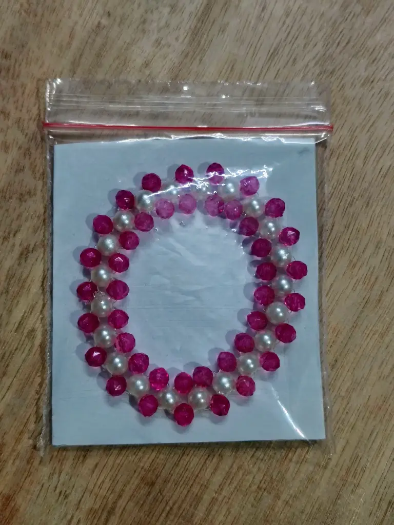 Pink and white pearl braided bracelet