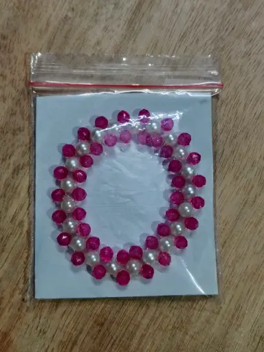 Pink and white pearl braided bracelet