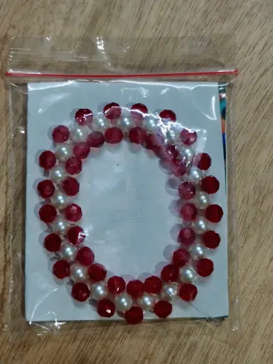 Red and white pearl braided bracelet